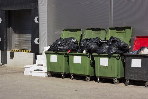 Environmentally friendly enclosed skip in use